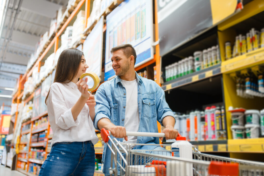 Couple with a cart buying building materials
